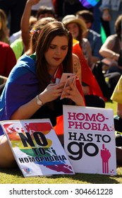 BRISBANE, AUSTRALIA - AUGUST 8 2015: Unidentified Rally Goer With Anti Homophobia Sign At Marriage Equality 