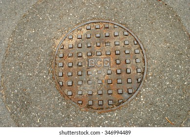 BRISBANE, AUSTRALIA, December 4th, 2015: Rusty Manhole Cover (BCC = Brisbane City Council)