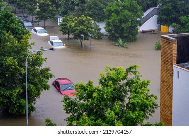 Brisbane, Australia - Feb 27, 2022: Roads flooded and car under water after the heavy rain in West End suburb, flood