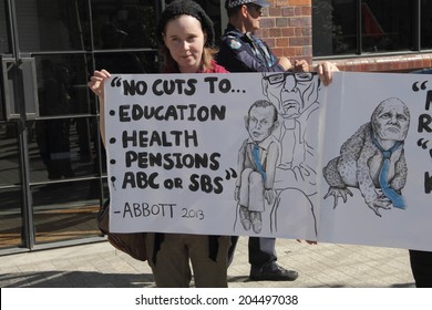 BRISBANE, AUSTRALIA - JULY 12 : Unidentified Protester With Broken LNP Election Promises Signs Outside Liberal National Party National Conference July 12, 2014 In Brisbane, Australia