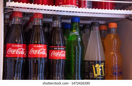 BRISBANE, AUSTRALIA - JULY 30 2019 Soft Drink, Cola, Coca Cola, Coke, Lemonade, Sprite, Fanta, Orange Bottles Aligned In A Fridge