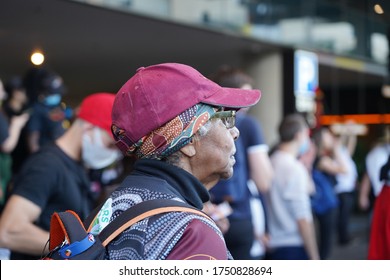 Brisbane, Australia - June 06, 2020: An Aboriginal woman looks on during the Black Lives Matter protest taking place against police brutality towards people of colour.
