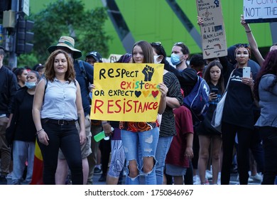 Brisbane, Australia - June 06, 2020: Teenage Girl Holds Up A Sign Against Police Brutality And The Senseless Murder Of George Floyd By Minneapolis Police Department. 