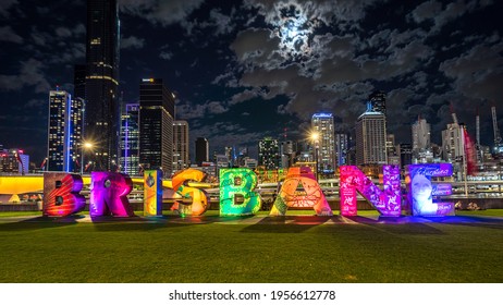 Brisbane, Australia - Mar 27, 2021: Illuminated Brisbane Sign With The City In The Background