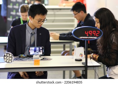 Brisbane, Australia - SEPTEMBER 24 2022: Please Be Quiet Brisbane Speedcubing Competition, Competitor At Completion Of Rubik's Clock Event.