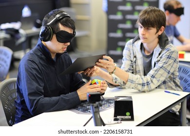 Brisbane, Australia - SEPTEMBER 4 2022: Please Be Quiet Brisbane Speedcubing Competition, Competitor Solving 3x3x3 Cube Blindfolded Event.