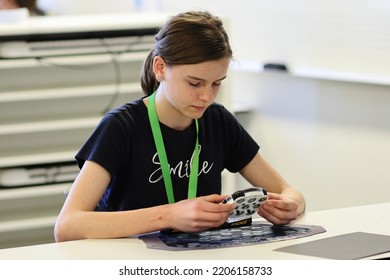 Brisbane, Australia - SEPTEMBER 4 2022: Please Be Quiet Brisbane Speedcubing Competition, Competitor Solving Rubik's Clock Event.