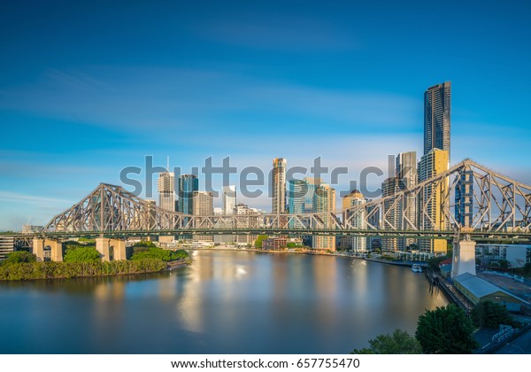 Brisbane\
city skyline and Brisbane river in\
Australia