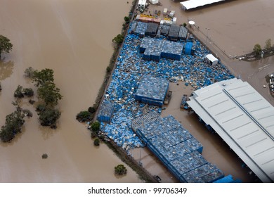 Brisbane Flood 2011 Aerial View Business Loss. Pallets Scattered By Flood Water During The Brisbane Flood Of 2011.  One Of Hundreds Of Businesses Suffering Loss After Brisbane River Broke Its Banks.