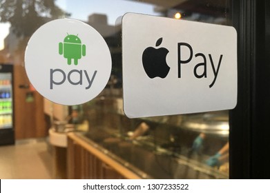 BRISBANE - JAN 19 2019:Apple And Android Pay Stickers On A Door To A Restaurant. It Is A Mobile Payment And Digital Wallet Service By Apple Inc And Google.