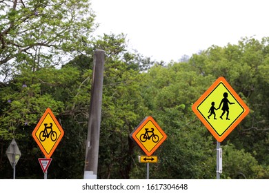 Brisbane QLD Australia 01/13/2020: A Colour Image Of Bright Road Signs That Help Pedestrians And Bike Riders Cross The Road In Safety.