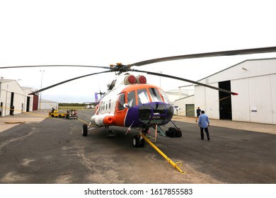 Brisbane QLD Australia 01/15/2020: A Big Rescue Copter Being Maintained At The Airport Outside The Hanger. Orange, White And Purple Service Helicopter Ready For Action.