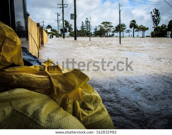 BRISBANE, QLD, AUSTRALIA - January 27: Sandbags\
protecting a local business during the floods in Sandgate, Brisbane\
on 27 January 2013