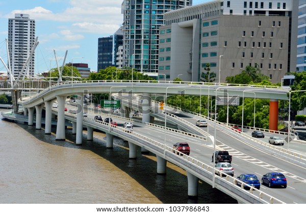 Brisbane,\
Queensland, Australia - January 6, 2018. View of Pacific motorway\
on river waterfront in Brisbane, with modern commercial and\
residential buildings, bridges and\
viaducts.