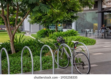 Brisbane, Queensland, Australia - March 2021: A Bicycle In Rack Outside A Garden Coffee Shop