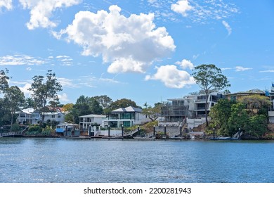 Brisbane, Queensland, Australia - September 2022: Luxury Homes On The River Banks With Their Own Boat Jetty. River Views, Expensive Lifestyle For The Fortunate Rich.