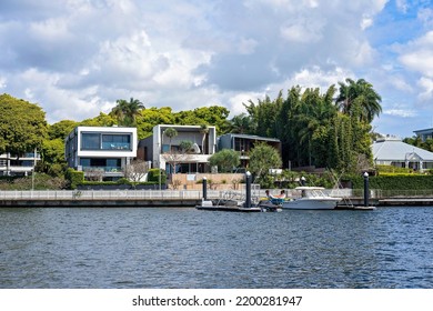 Brisbane, Queensland, Australia - September 2022: Luxury Homes On The River Banks With Their Own Boat Jetty. River Views, Expensive Lifestyle For The Fortunate Rich.