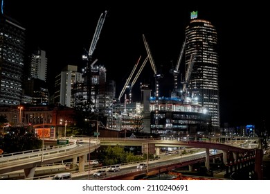 Brisbane, Queensland Australia - September 23 2021: Night view of the central business district showing the construction of the Queen's Wharf with the Riverside Expressway and Brisbane river.