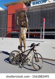 Brisbane, Queensland / Australia - September 8 2019: A Mountain Bike Beside The Bronze Statue Of Rugby League Legend Wally Lewis At The Entrance Of Suncorp Stadium