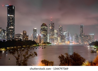 Brisbane skyline by night. Beautiful view of the Brisbane city and river at night with building glowing after a stormy summer evening in Australia