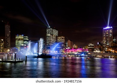 Brisbane skyline lit up for the festival firework display. Night shot Brisbane city lights reflecting in the Maiwar river. Queensland state capital, Australia. Logos removed.
