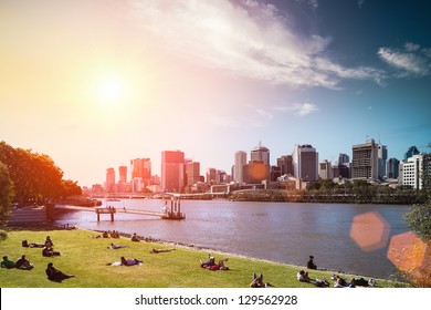 brisbane skyline and people in lawn against a blue sky,queensland, Australia
