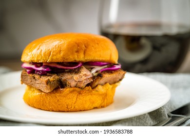 Brisket Slider Sandwich Bun On White Plate Red Wine Dinner Lunch Appetizer Meal Texas BBQ Barbecue Barbeque