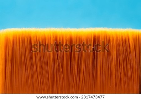 Bristles of paint brush close-up on blue background Abstract modern poster Empty space for your text Creative concept opy space for design Web banner