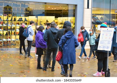 Bristol, England/UK-October 24th 2020: People waiting outside Apple store. 