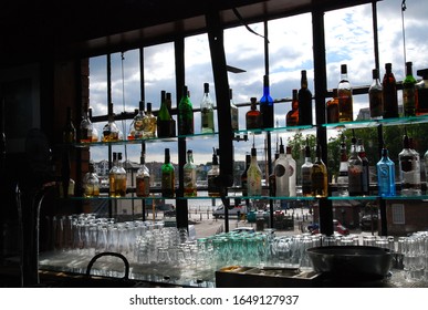 Bristol, UK - 7 29 2010: View Out The Bar Window With Bottles At Mud Dock Cafe