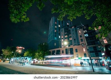 Bristol, UK - August 04 2021: Long Exposure Of Light Trails Through Bus Station In City At Night