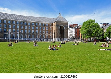 BRISTOL, UK - MAY 22, 2017: Sunbathers On College Green Take Advantage Of The Fine Weather On A Sunny Spring Day.