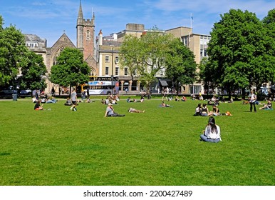 BRISTOL, UK - MAY 22, 2017: Sunbathers On College Green Take Advantage Of The Fine Weather On A Sunny Spring Day.