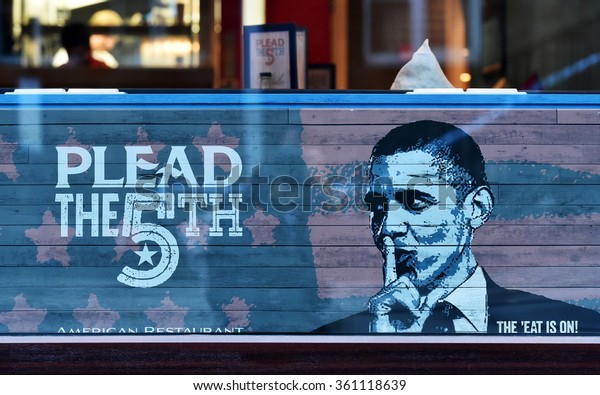 BRISTOL, UK - OCT 31, 2015: View of Barack Obama themed artwork in the window of a city centre restaurant. The west country city is famous for its graffiti and street art scene. 