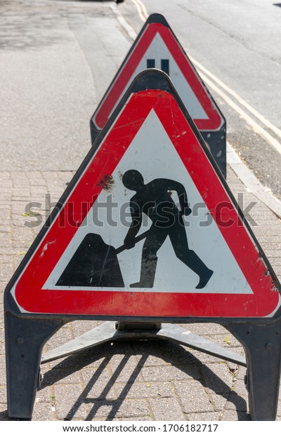 Bristol-April 2020-England-a close up view of\
warning road working signs on a side road\
