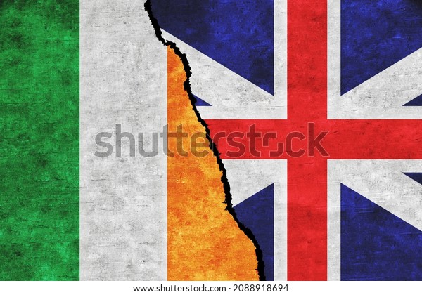 Britain and Ireland painted flags on a wall with\
a crack. Britain and Ireland conflict. Ireland and Britain flags\
together. Britain vs\
Ireland