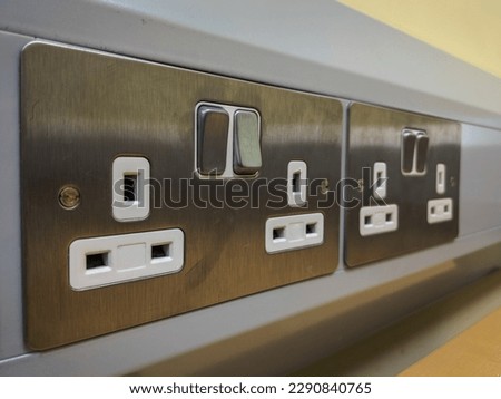 British 3 pin double wall sockets with a brushed steel finish