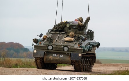 British army FV103 Spartan tracked armored reconnaissance vehicle in action on a military exercise  Salisbury Plain, Wiltshire UK
