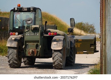 British Army JCB Fork Lift Truck Moving Boxed Weapons In Preparation For Next Military Exercise, Wiltshire UK