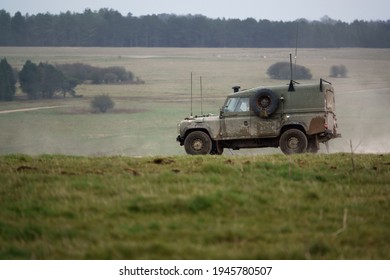 British Army Land Rover Defender Wolf medium utility vehicle on military exercise Salisbury Plain, Wiltshire, UK - Shutterstock ID 1945780507