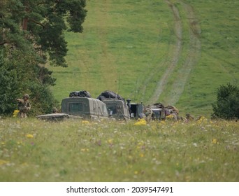 British army Land Rover Defender Wolf military light utility vehicle with infantry soldiers on exercise, Salisbury Plain UK
