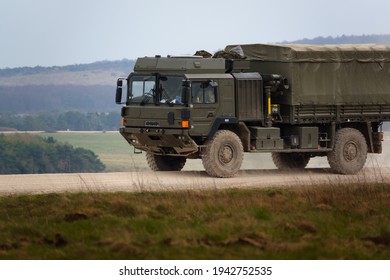 British Army MAN SV 4x4 Army Logistics Lorry Vehicle Truck Driving Along A Dirt Track In Action On A Military Exercise, Salisbury Plain UK