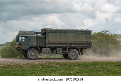 British Army MAN SV 4x4 Army Lorry Logistics Vehicle Truck Driving Along A Dirt Track In Action On A Military Exercise, Salisbury Plain UK