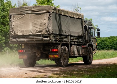 British Army MAN SV 4x4 Logistics Truck Driving Away From Camera On A Military Exercise