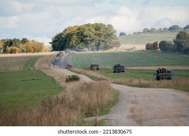 British Army Mechanised Armoured Unit Of Challenger 2 Tanks, Warrior FV510s, Bulldog FV432s And CRARRVs In Action On A Military Exercise, Wiltshire UK