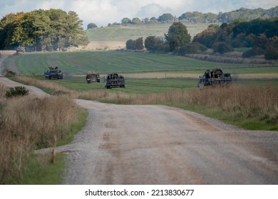 British Army Mechanised Armoured Unit Of Challenger 2 Tanks, Warrior FV510s, Bulldog FV432s And CRARRVs In Action On A Military Exercise, Wiltshire UK