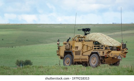 British Army Supacat Jackal (MWMIK) Rapid Assault, Fire Support And Reconnaissance Vehicle In Action On A Military Exercise, Salisbury Plain Military Training Area