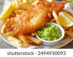 british bistro old pub fish and potato chips served with a side of mushy peas classic 