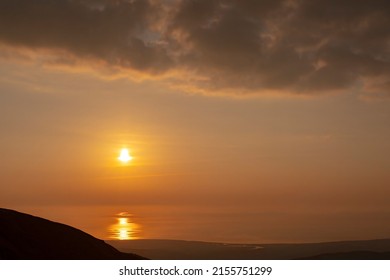 British Coastal Sunset Scene Over The Welsh Coast In Snowdonia Wales