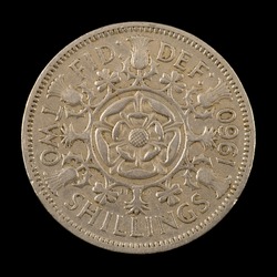 The British Coin On The Black Background